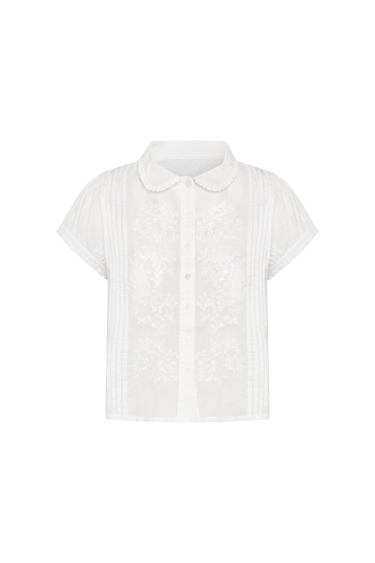 White blouse with a Peter Pan collar on a white background