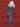 Person wearing a blue denim outfit against a red background