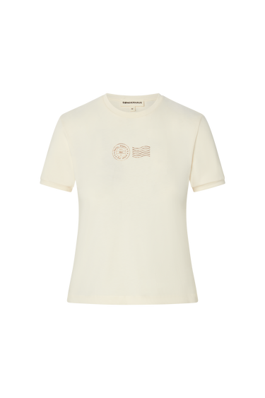 Cream t-shirt with brown stamp-style graphics on a white background.