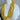 Yellow beaded necklace on a white mannequin bust