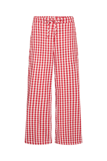 Red and white gingham pants on a white background.