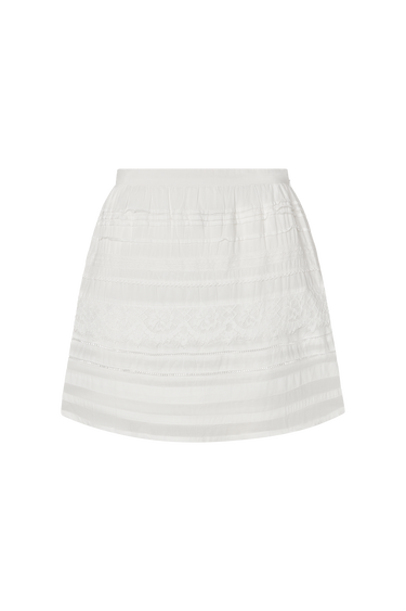 White skirt with eyelet detailing on a white background