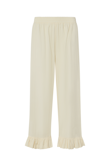 Cream pants with ruffled ankle hem on a white background.