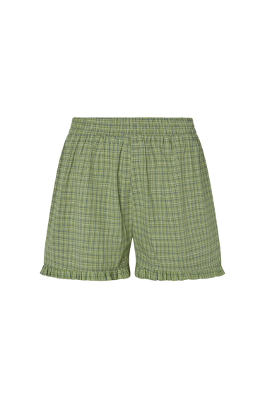 Green plaid boxer-style shorts with a ruffle detail at the bottom on a white background.