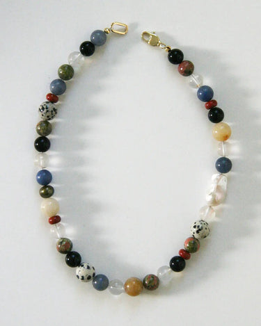 Necklace with multicolored beads on a white background