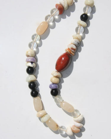 Necklace with multicolored beads on a white background