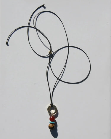 Necklace with beads on a light gray background