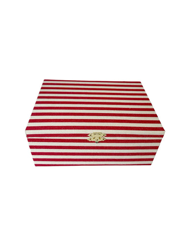 Hexagonal red and white striped box with a gold emblem on a white background