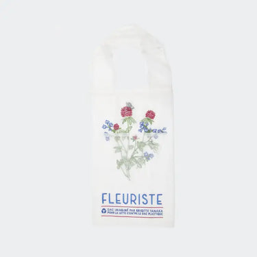 White tote bag with floral design and 'Fleuriste' text on a white background