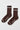 Pair of brown socks with white stripes and 'Le Bon Shoppe' branding on a light gray background