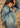 Woman wearing a denim jacket in a desert setting