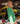 Woman wearing a green cardigan in a flower shop