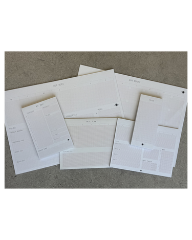 Set of white paper templates on a brown surface