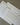 Set of white planner sheets with various schedules and notes on a textured surface