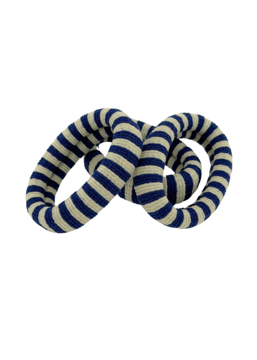 Blue and beige striped dog toy on a white background