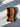 Brown knitted balaclava on a light gray surface