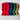 Four colorful knitted hats in red, blue, green, and yellow on a light gray background.