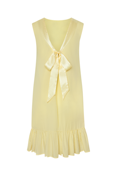Yellow dress with a bow detail on a white background