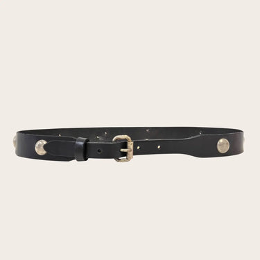 Black leather belt with brass buckle on a beige background