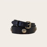 Black leather belt with silver buckles on a beige background