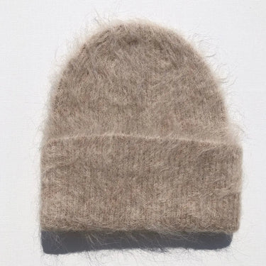 Brown knitted beanie on a white background