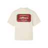 Cream t-shirt with a red sardine tin graphic that says "Sønderhaus Sardines" on a white background.