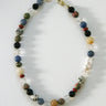 Necklace with multicolored beads on a white background
