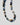 Necklace with multicolored beads on a white background