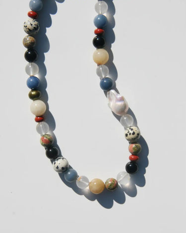 Necklace with multicolored beads on a white background
