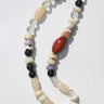 Necklace with multicolored beads on a white background