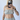 Person wearing a light gray sleeveless top and pants, taking a mirror selfie.