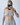 Person wearing a light gray sleeveless top and pants, taking a mirror selfie.