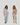 Before and after comparison of a woman wearing light gray clothing against a white background.