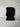 Black ribbed knit balaclava on a light gray marble surface