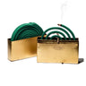 Gold mosquito coil holder on a white background, holding a green coil with visible smoke rising from the front burner.
