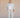 Person wearing a light gray outfit with a white background