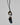 Necklace with three beads on a white background