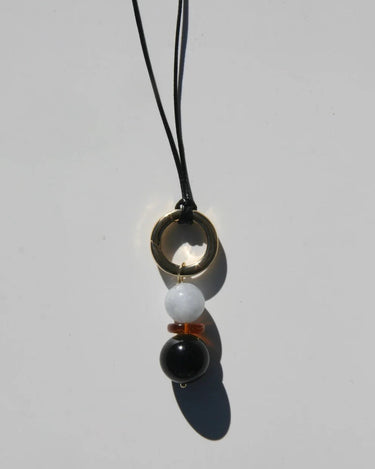 Necklace with three beads on a white background