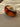 Brown bangle on a beige surface