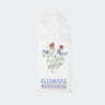 White tote bag with floral design and 'Fleuriste' text on a white background