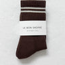 Brown sock with white stripes on a white background, labeled 'Le Bon Shoppe'.
