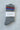 Gray socks with red and blue stripes on a textured white surface, featuring 'Le Bon Shoppe' label.