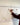 Person marking a date on a wall calendar with a pen.