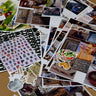 Collage of various photos and printed materials on a surface