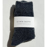 Pair of dark gray cashmere pointelle socks with 'Le Bon Shoppe' label on a light gray background