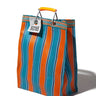 Striped orange and blue bag with a tag on a white background