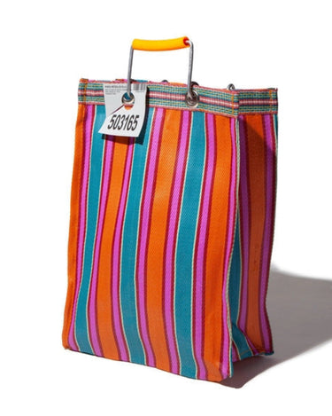 Woven rectangle-shaped bag with a orange, pink, and blue striped pattern.