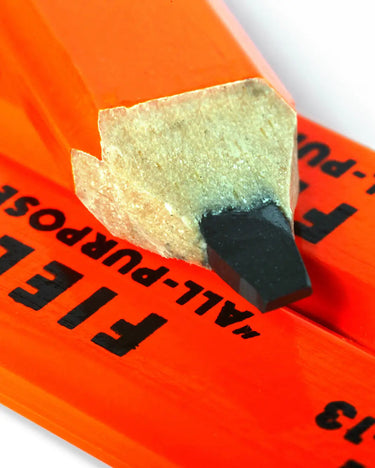 Close-up of a pencil with an orange casing labeled 'All-Purpose Field' on a white background.