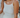 Woman wearing a gold necklace and cream-colored pointelle tank top.