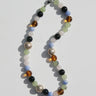 Multicolored beaded necklace on a white background